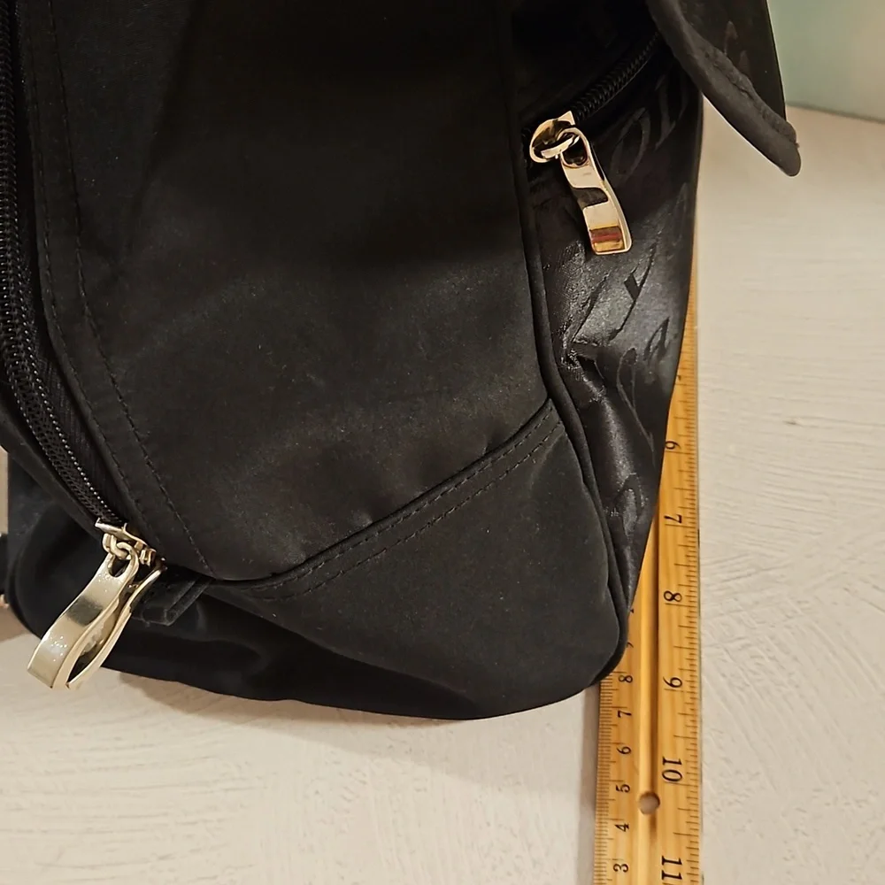 Black backpack convertible bag international city names on sections EUC